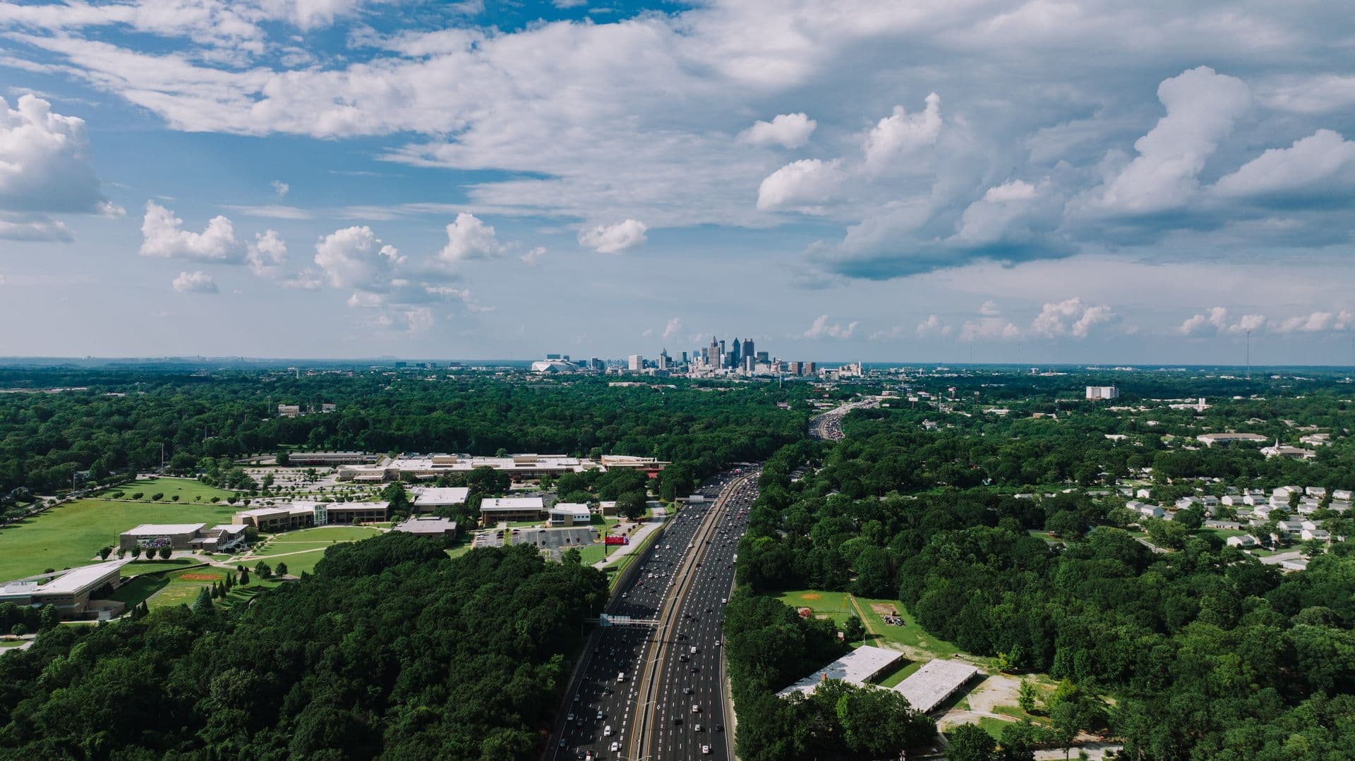 Aerial view of an Atlanta highway leading into the downtown skyline